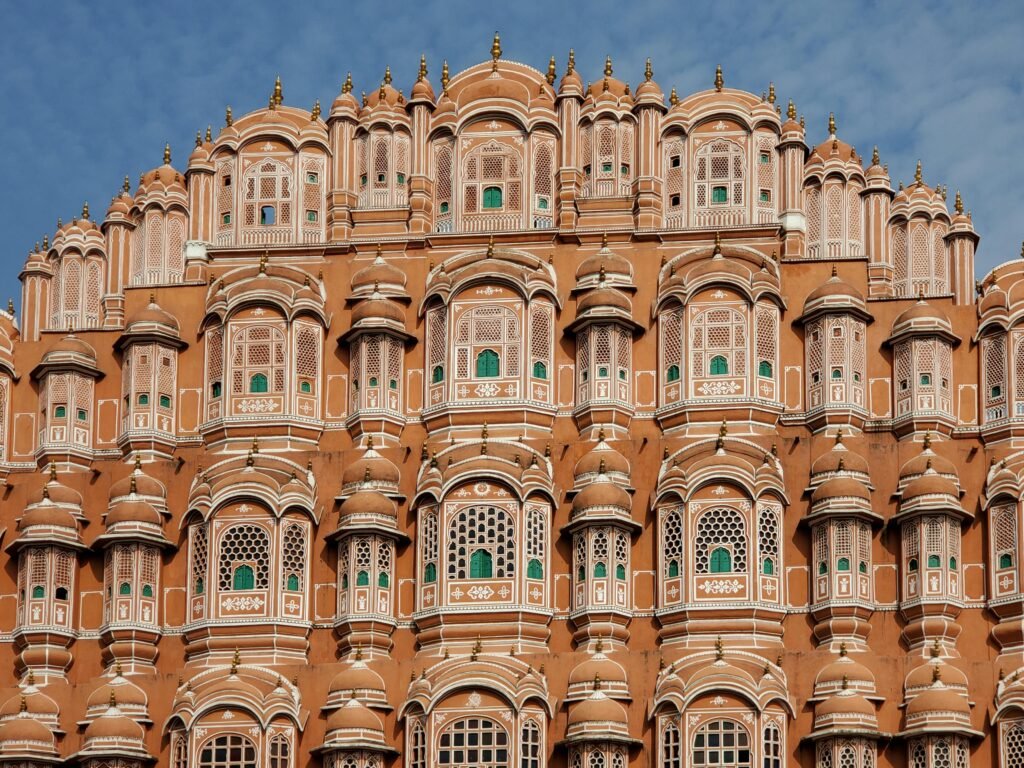 Stunning view of Hawa Mahal's intricate facade in Jaipur, showcasing Mughal architecture.