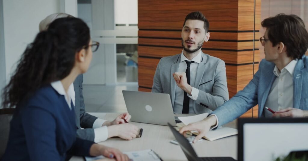 Professional business team collaborating in a modern office meeting.